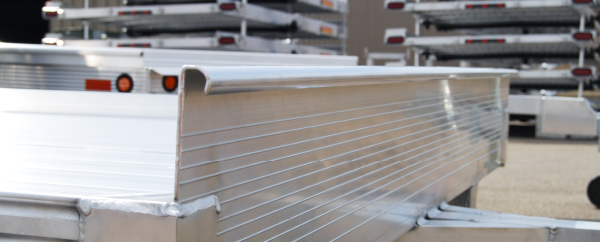 Curled aluminum rail adds durability and tie-down location